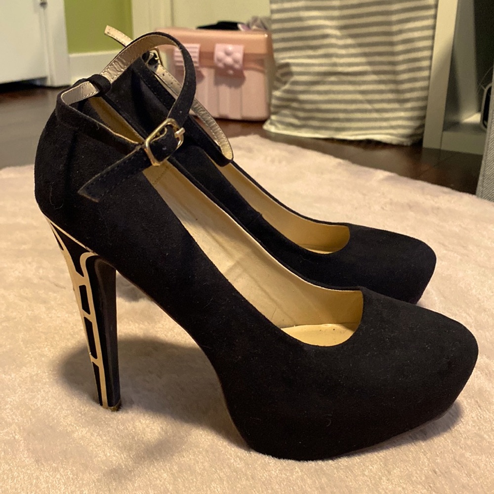Gold accented black platform pumps